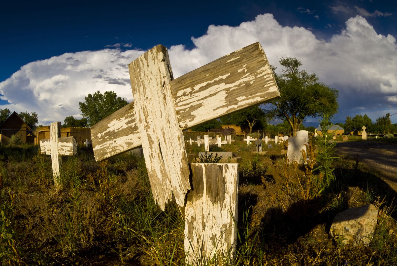 Weathered wooden crosses in a cemetery in Corrales, New Mexico